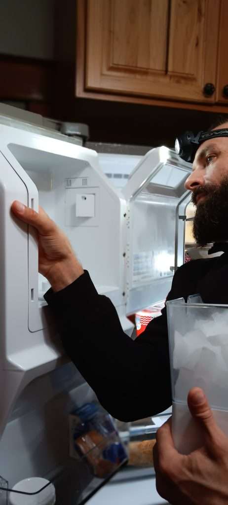 Dan of 877MRFIX06 working on an fridge Icemaker.