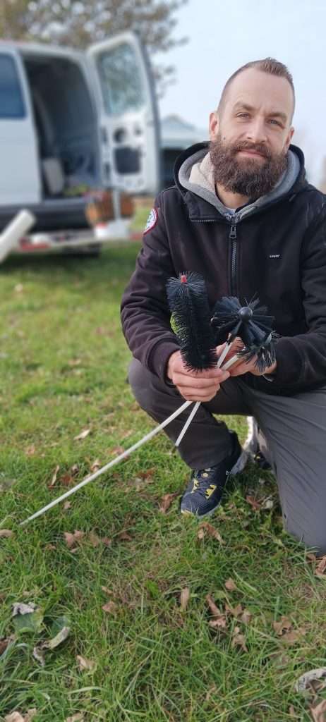 Dan with a dryer vent cleaning kit.