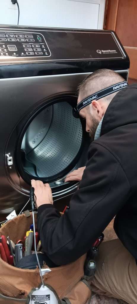 Dan Checks The Bellow On A Washer.