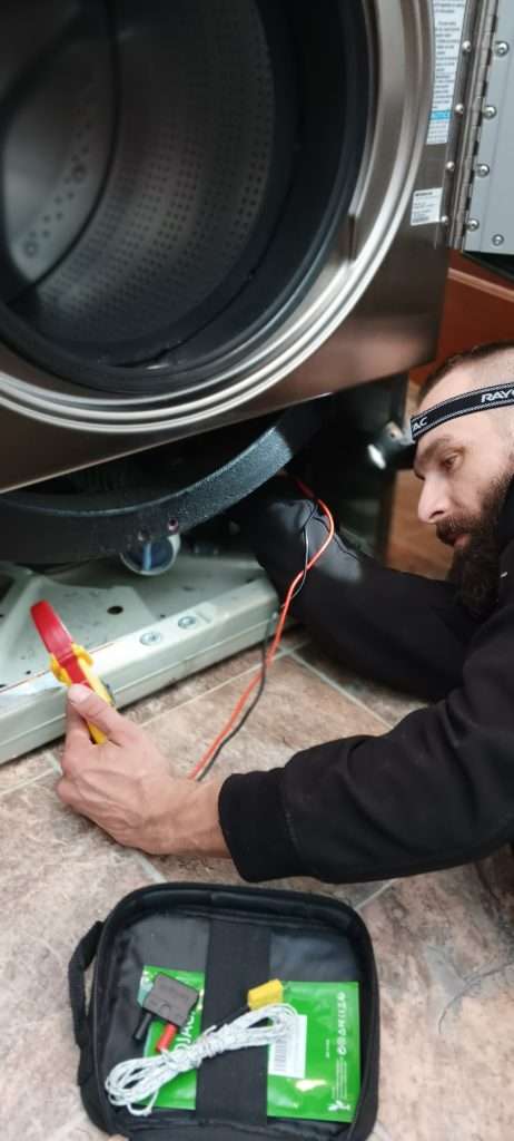 Dan Tests The Drain Pump On A Washer.